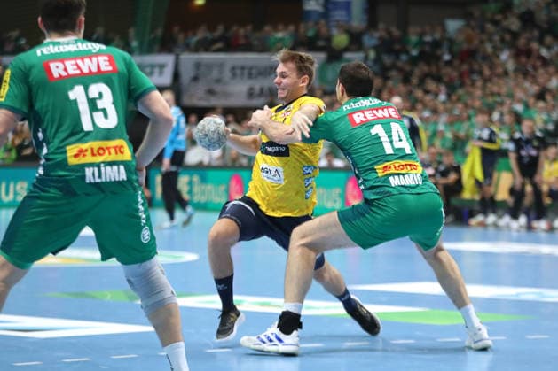 Handball DAIKIN HBL, SC DHfK Leipzig Rhein Neckar Löwen 27 12 2025 Mathias Larson 4, Rhein Neckar Löwen vs Marko Mamic 14, SC DHfK Leipzig Handball, DAIKIN HBL, 1 Bundesliga, Season 2025 2026, 19 Matchday SC DHfK Leipzig vs Rhein Neckar Löwen on 27 12 2025 at Quarterback Immobilien Arena Leipzig Copyright: xBEAUTIFULxSPORTS JanxKaeferx