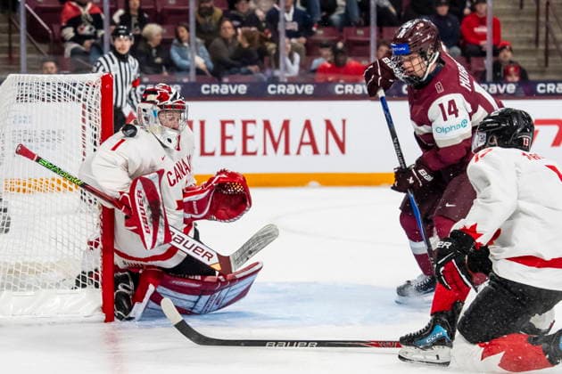 December 27, 2025, Minneapolis, Mn, Canada: Canada s goaltender Jack Ivankovic (1) makes a save against Latvia s Alberts Smits (23), not shown, during second period IIHF World Junior Championship hockey action, in Minneapolis, Saturday, Dec. 27, 2025. Canada News - December 27, 2025 - ZUMAc35_ 20251227_zaf_c35_087 Copyright: xChristopherxKatsarovx