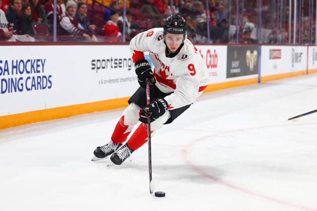 December 27, 2025, Minneapolis, Minnesota, United States: Canada forward GAVIN McKENNA (9) collects the puck in the corner of the ice. Canada and Latvia faced off in the opening round of the IIHF World Junior Championship on December 27th. Canada was victorious, winning 2-1 in overtime. Minneapolis United States - ZUMAt166 20251227_zsp_t166_009 Copyright: xMichaelxTurnerx