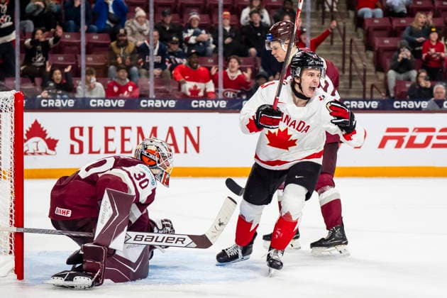 December 27, 2025, Minneapolis, Mn, Canada: Canada s Cole Reschny (21) celevbrates in front of Latvia goaltender Nils Maurins (30) after Canada defeated Latvia in overtime IIHF World Junior Championship hockey action, in Minneapolis, Saturday, Dec. 27, 2025. Canada News - December 27, 2025  - ZUMAc35_ 20251227_zaf_c35_096 Copyright: xChristopherxKatsarovx
