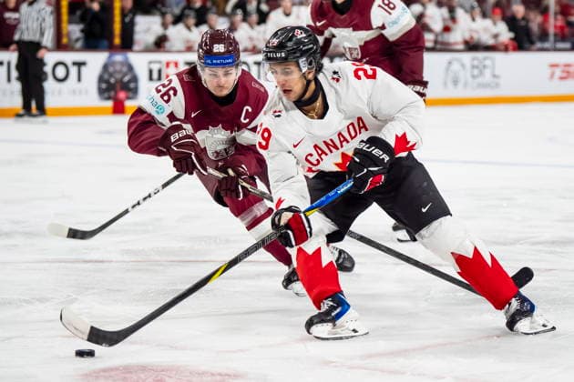 December 27, 2025, Minneapolis, Mn, Canada: Canada s Michael Hage (29) skates with the puck while ..Latvia s Oskars Briedis (26) defends during third period IIHF World Junior Championship hockey action, in Minneapolis, Saturday, Dec. 27, 2025. Canada News - December 27, 2025  - ZUMAc35_ 20251227_zaf_c35_101 Copyright: xChristopherxKatsarovx