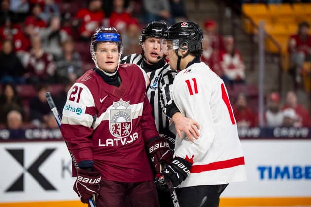 December 27, 2025, Minneapolis, Mn, Canada: Canada s Tij Iginla (11) speaks to Latvia s Krists Retanais (21) during third period IIHF World Junior Championship hockey action, in Minneapolis, Saturday, Dec. 27, 2025. Canada News - December 27, 2025  - ZUMAc35_ 20251227_zaf_c35_105 Copyright: xChristopherxKatsarovx