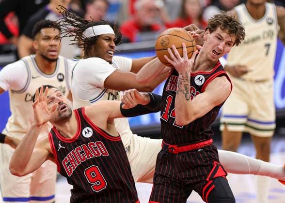 (251228) -- CHICAGO, Dec. 28, 2025 -- Matas Buzelis (1st R) of Chicago Bulls grabs a rebound during NBA, Basketball Herren, USA regular season basketball game between Milwaukee Bucks and Chicago Bulls at United Center in Chicago, the United States, on Dec. 27, 2025. (Photo by Xinhua) (SP)U.S.-CHICAGO-BASKETBALL-NBA-BUCKS VS BULLS JoelxLerner 