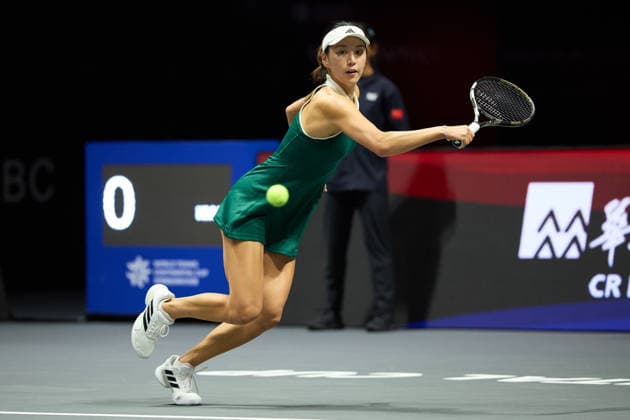 SHENZHEN, CHINA - DECEMBER 27: Wang Xinyu of China returns a shot in the Women s Singles match against Iga Swiatek of Poland on day 2 of the 2025 World Tennis Continental Cup at Shenzhen Universiade Center on December 27, 2025 in Shenzhen, Guangdong Province of China.  Copyright: xVCGx 111612189050