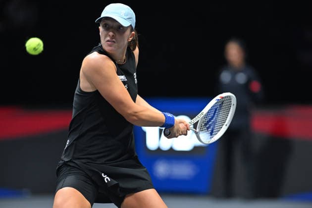 SHENZHEN, CHINA - DECEMBER 27: Iga Swiatek of Poland returns a shot in the Women s Singles match against Wang Xinyu of China on day 2 of the 2025 World Tennis Continental Cup at Shenzhen Universiade Center on December 27, 2025 in Shenzhen, Guangdong Province of China.  Copyright: xVCGx 111612196388