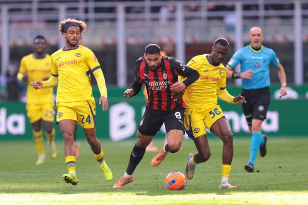 Milan, Italy, 28th December 2025. Antoine Bernede of Hellas Verona looks on as team mate Cheikh Niasse challenges Ruben Loftus-Cheek of AC Milan the AC Milan vs Hellas Verona Serie A match at Giuseppe Meazza, Milan. Picture credit should read: Jonathan Moscrop Sportimage EDITORIAL USE ONLY. No use with unauthorised audio, video, data, fixture lists, club league logos or live services. Online in-match use limited to 120 images, no video emulation. No use in betting, games or single club league player publications. SPI_009_JM_MILAN_VERONA SPI-4369-0009