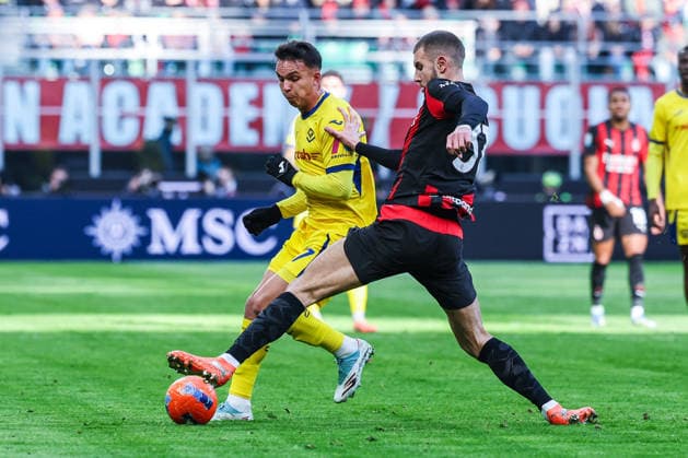 CALCIO - Serie A - AC Milan vs Hellas Verona FC Strahinja Pavlovic of AC Milan competes for the ball with Rafik Belghali of Hellas Verona FC during Serie A 2025 26 football match between AC Milan and Hellas Verona FC at San Siro Stadium in Milan Milan Italy  Copyright: xIPAxSport ABACAx