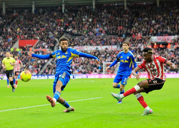 Sunderland v Leeds United Premier League Romaine Mundle of Sunderland is tackled by Jayden Bogle of Leeds United during the Premier League match at the Stadium of Light, Sunderland 28 12 2025 UK Newspapers OUT Copyright: xFredxPalmerx FIL-22706-0092