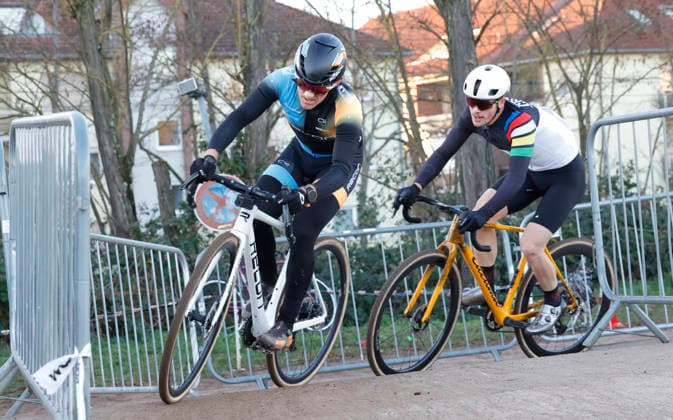 28 12 2025 Cycling Darmstadt cyclo-cross race at the velodrome here race juniors U19 and elite men here left start number 20 cyclo-cross world champion Sascha Starker SSG Bensheim right start number 87 Elias Ray U23m RSV Seeheim Darmstadt Hessen Germany
