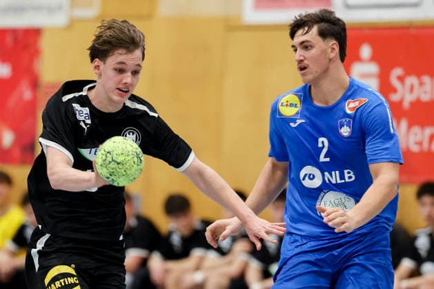 Jasper Anschuetz Germany and Tjas Erculj Slovenia battle for the ball, Merzig Cup semi-final, Germany vs Slovenia, Thiels Park Sporthalle on December 29, 2025 in Merzig, Germany Photo by Marco Steinbrenner DeFodi Images Jasper Anschuetz Germany and Tjas Erculj Slovenia battle for the ball, Merzig Cup semi-final, Germany vs Slovenia, Thiels Park Sporthalle, December 29, 2025 in Merzig, Germany Photo by Marco Steinbrenner DeFodi Images