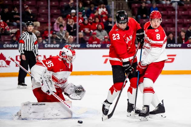 December 29, 2025, Minneapolis, Mn, Canada: Canada s Sam O Reilly (23) shoots on Denmark s Patrick Tiedjen (35) while teammate Jesper Bank Olesen (8) defends during first period IIHF World Junior Championship hockey action in Minneapolis on Monday, Dec. 29, 2025. Canada News - December 29, 2025  - ZUMAc35_ 20251229_zaf_c35_052 Copyright: xChristopherxKatsarovx