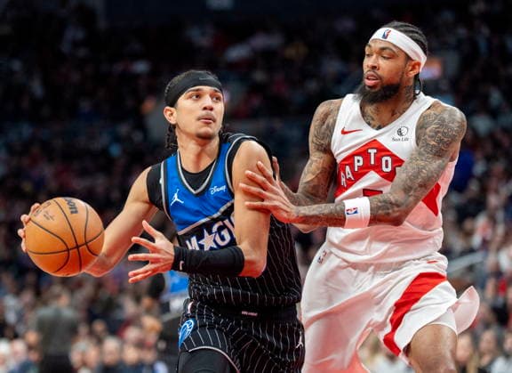 December 29, 2025, Toronto, On, Canada: Orlando Magic guard Anthony Black (left) drives against Toronto Raptors Brandon Ingram during second half NBA, Basketball Herren, USA action in Toronto on Monday December 29, 2025. Canada News - December 29, 2025  - ZUMAc35_ 20251229_zaf_c35_057 Copyright: xFrankxGunnx