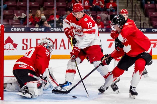 December 29, 2025, Minneapolis, Mn, Canada: Canada goaltender Carter George (30) and Harrison Brunicke (4) defend against Denmark s William Bundgaard (19) in front of the net during second period IIHF World Junior Championship hockey action in Minneapolis on Monday, Dec. 29, 2025. Canada News - December 29, 2025  - ZUMAc35_ 20251229_zaf_c35_063 Copyright: xChristopherxKatsarovx
