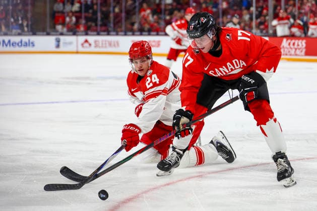 December 29, 2025, Minneapolis, Minnesota, United States: Canada forward JETT LUCHANKO (17) and Denmark forward MADS KLYVO (24) reach out for the puck.Canada and Denmark faced off in the opening round of the IIHF World Junior Championship on December 29th. Canada was victorious 9-1. Minneapolis United States - ZUMAt166 20251229_zsp_t166_032 Copyright: xMichaelxTurnerx