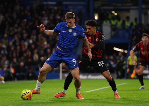 30th December 2025; Stamford Bridge, Chelsea, London, England: Premier League Football, Chelsea versus Bournemouth; Liam Delap of Chelsea challenged by James Hill of AFC Bournemouth  JohnxPatrickxFletcher