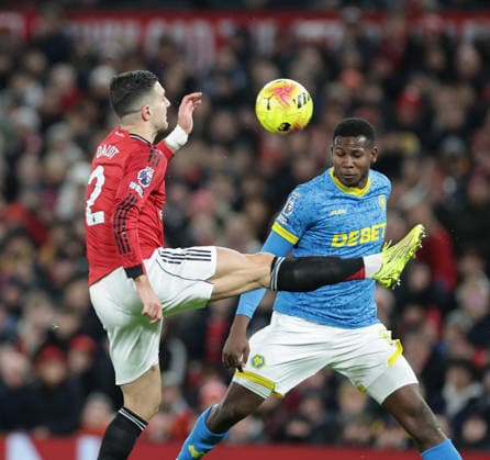 30th December 2025; Old Trafford, Manchester, England; Premier League Football, Manchester United, ManU versus Wolverhampton Wanderers; Diogo Dalot of Manchester United controls a high ball  RogerxEvans