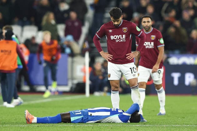 30th December 2025; London Stadium, London, England; Premier League Football, West Ham United versus Brighton and Hove Albion; Lucas Paqueta of West Ham United looks over Yankuba Minteh of Brighton And Hove Albion on the ground injured  IanxStephen