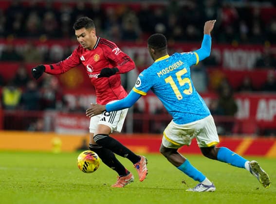 Manchester, England, 30th December 2025. Casemiro of Manchester United, ManU and Yerson Mosquera of Wolverhampton Wanderers during the Manchester United vs Wolverhampton Wanderers Premier League match at Old Trafford, Manchester. Picture credit should read: Andrew Yates Sportimage EDITORIAL USE ONLY. No use with unauthorised audio, video, data, fixture lists, club league logos or live services. Online in-match use limited to 120 images, no video emulation. No use in betting, games or single club league player publications. SPI_071_AY_Man_Utd_Wolves SPI-4404-0072