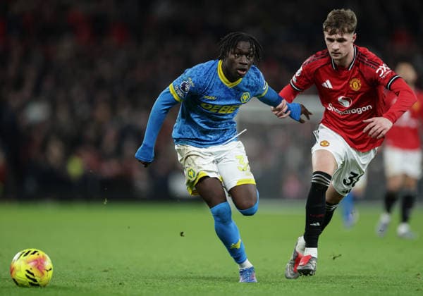 30th December 2025; Old Trafford, Manchester, England; Premier League Football, Manchester United, ManU versus Wolverhampton Wanderers; Mateus Mane of Wolverhampton Wanderers is tracked by Jack Fletcher of Manchester United  RogerxEvans