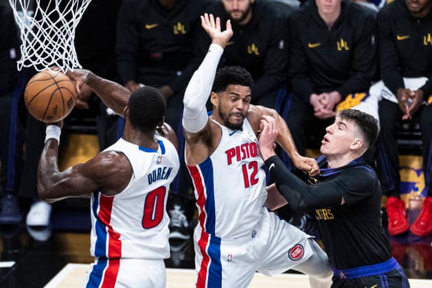 December 30, 2025, Los Angeles, California, USA: Los Angeles Lakers Jake LaRavia (12) vies for the rebound against Detroit Pistons Tobias Harris (12) and Jalen Duren (0) during an NBA, Basketball Herren, USA basketball game on Tuesday, Dec. 30, 2025 in Los Angeles. Los Angeles USA - ZUMAc68_ 20251230_zaf_c68_031 Copyright: xRingoxChiux
