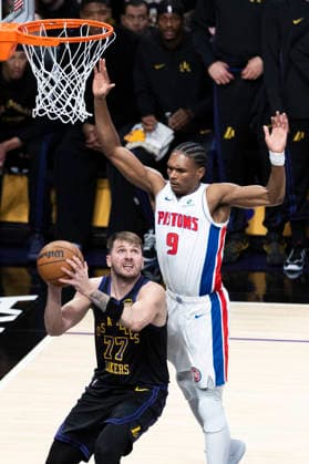 December 30, 2025, Los Angeles, California, USA: Los Angeles Lakers Luka DonÄÂiÄ¡ (77) fakes Detroit Pistons Ausar Thompson (9) into the air during an NBA, Basketball Herren, USA basketball game on Tuesday, Dec. 30, 2025 in Los Angeles. Los Angeles USA - ZUMAc68_ 20251230_zaf_c68_032 Copyright: xRingoxChiux