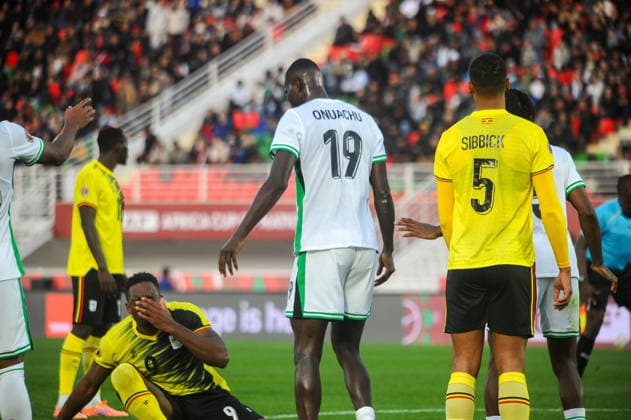 FES, MOROCCO - DECEMBER 30: Uche Ikpeazu of Uganda and Paul Onuachu of Nigeria during the Africa Cup of Nations (AFCON) match between Uganda and Nigeria on December 30th, 2025 at Complexe Sportif De Stade, Fes, Morocco. Photo by Segun Ogunfeyitimi Copyright: xshengolpixsx