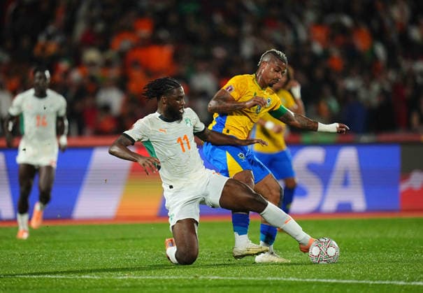 Mario RenÃ Junior Lemina Gabon and Jean Philippe Nils Stephan Krasso CÃ te d Ivoire battle for the ball during the Africa Cup Of Nations match between Gabon and Ivory Coast at Marrakesh Stadium on December 31, 2025 in Marrakech, Morocco Photo by Thor Wegner DeFodi Images