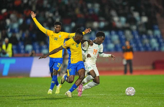 Andre Biyogo Poko Gabon and Christ Ravynel Inao Oulai Côte d Ivoire battle for the ball during the Africa Cup Of Nations match between Gabon and Ivory Coast at Marrakesh Stadium on December 31, 2025 in Marrakech, Morocco Photo by Thor Wegner DeFodi Images