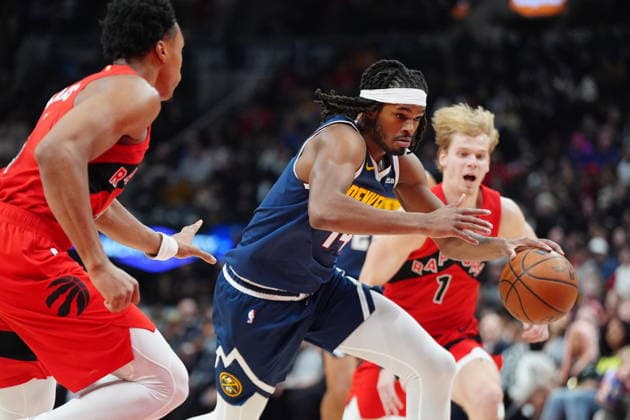December 31, 2025, Toronto, On, CANADA: Denver Nuggets forward Daron Holmes II (14) drives up court between Toronto Raptors Scottie Barnes (4) and Raptors guard Gradey Dick (1) during first half NBA, Basketball Herren, USA action in Toronto on Wednesday December 31, 2025. Canada News - December 31, 2025  - ZUMAc35_ 20251231_zaf_c35_051 Copyright: xFrankxGunnx