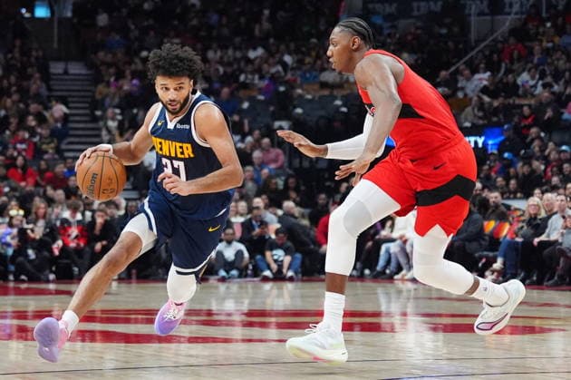 December 31, 2025, Toronto, On, CANADA: Denver Nuggets guard Jamal Murray (27) moves around Toronto Raptors forward guard RJ Barrett, right, during first half NBA, Basketball Herren, USA action in Toronto on Wednesday December 31, 2025. Canada News - December 31, 2025 - ZUMAc35_ 20251231_zaf_c35_054 Copyright: xFrankxGunnx