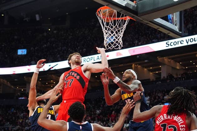 December 31, 2025, Toronto, On, CANADA: Toronto Raptors forward Jamison Battle (77) and Denver Nuggets guard forward Bruce Brown (11) battle under the basket during second half NBA, Basketball Herren, USA action in Toronto on Wednesday December 31, 2025. Canada News - December 31, 2025  - ZUMAc35_ 20251231_zaf_c35_066 Copyright: xFrankxGunnx