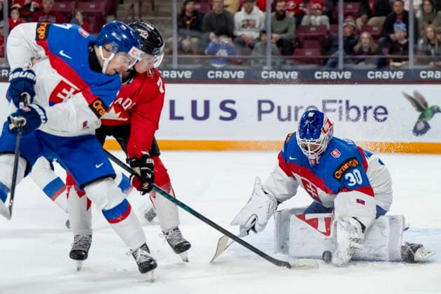 January 2, 2026, Minneapolis, Mn, USA: Canada s Michael Misa (centre) shoots on Slovakia goaltender Alan Lendak (30) while Slovakia s Adam Kalman (7) defends during second period IIHF World Junior Championship quarterfinal hockey action, in Minneapolis, Minn., on Friday, January 2, 2026. Canada News - January 2, 2026 - ZUMAc35_ 20260102_zaf_c35_021 Copyright: xChristopherxKatsarovx