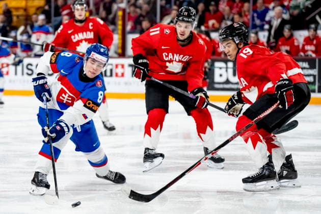 January 2, 2026, Minneapolis, Mn, USA: Slovakia s Michal Liscinsky (8) is defended by Canada s Tij Iginla (11) and Zayne Parekh (19) during third period IIHF World Junior Championship quarterfinal hockey action, in Minneapolis, Minn., on Friday, January 2, 2026. Canada News - January 2, 2026 - ZUMAc35_ 20260102_zaf_c35_030 Copyright: xChristopherxKatsarovx