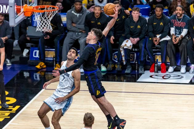 January 2, 2026, Los Angeles, California, USA: Los Angeles LakersÃ¢â‚¬â ¢ Jake LaRavia (12) dunks against Memphis Grizzlies Santi Aldama (7) during an NBA, Basketball Herren, USA basketball game at Crypto.com Arena on Friday, Jan. 2, 2026 in Los Angeles. Los Angeles USA - ZUMAc68_ 20260102_zaf_c68_001 Copyright: xRingoxChiux