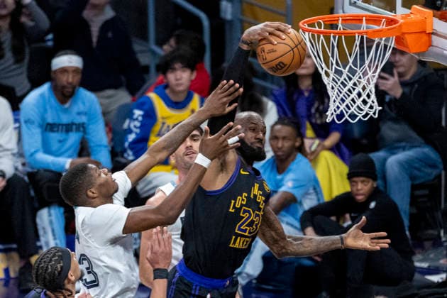 January 2, 2026, Los Angeles, California, USA: Los Angeles LakersÃ¢â‚¬â ¢ LeBron James (23) grabs a rebound against Memphis Grizzlies Cedric Coward (23) during an NBA, Basketball Herren, USA basketball game at Crypto.com Arena on Friday, Jan. 2, 2026 in Los Angeles. Los Angeles USA - ZUMAc68_ 20260102_zaf_c68_020 Copyright: xRingoxChiux