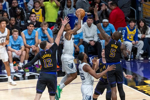 January 2, 2026, Los Angeles, California, USA: Memphis Grizzlies Ja Morant (12) shoots under pressure from Los Angeles LakersÃ¢â‚¬â ¢ Jake LaRavia (12) and Deandre Ayton (5) during an NBA, Basketball Herren, USA basketball game at Crypto.com Arena on Friday, Jan. 2, 2026 in Los Angeles. Los Angeles USA - ZUMAc68_ 20260102_zaf_c68_029 Copyright: xRingoxChiux
