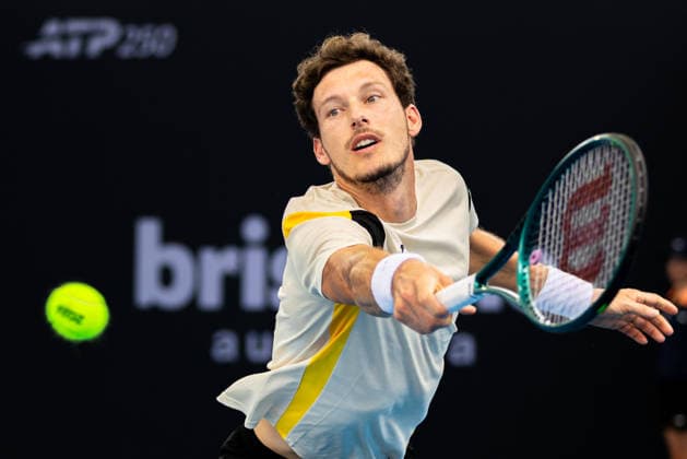 January 3, 2026, Brisbane, Qld, Australia: PABLO CARRENO BUSTA of Spain reaches for the ball during his MenÃ¢â‚¬â ¢s Singles qualifying round match against MATTIA BELLUCCI of Italy at the Brisbane International. Brisbane Australia - ZUMAt173 20260103_zsp_t173_008 Copyright: xStephanexThomasx
