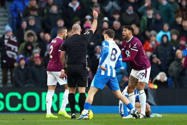 Josh Laurent of Burnley is shown a yellow card by Tim Robinson match referee Brighton and Hove Albion v Burnley, Premier League, Football, American Express Community Stadium, Brighton, UK - 03 Jan 2026Brighton American Express Community Stadi United Kingdom EDITORIAL USE ONLY No use with unauthorised audio, video, data, fixture lists, club league logos or live services. Online in-match use limited to 120 images, no video emulation. No use in betting, games or single club league player publications.  Copyright: xSimonxDael Shutterstockx 16220497o