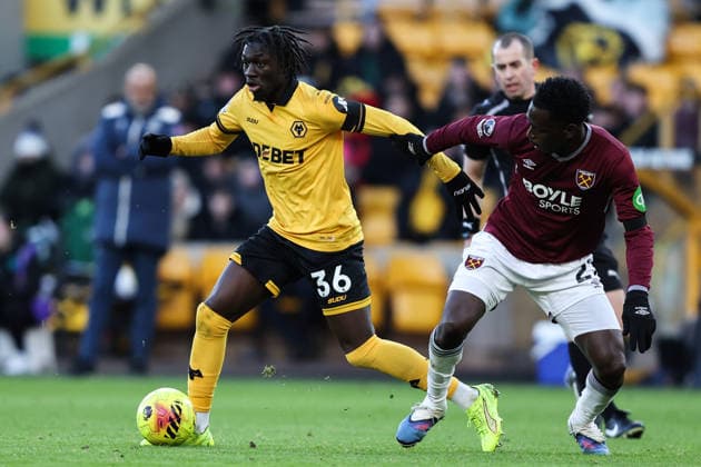 Wolverhampton, England, 3rd January 2026. Mateus Mane of Wolverhampton Wanderers holds off Soungoutou Magassa of West Ham United during the Wolverhampton Wanderers vs West Ham United Premier League match at Molineux, Wolverhampton. Picture credit should read: Gareth Evans Sportimage EDITORIAL USE ONLY. No use with unauthorised audio, video, data, fixture lists, club league logos or live services. Online in-match use limited to 120 images, no video emulation. No use in betting, games or single club league player publications. SPI_031_GE_WOL_vs_WHU SPI-4427-0034