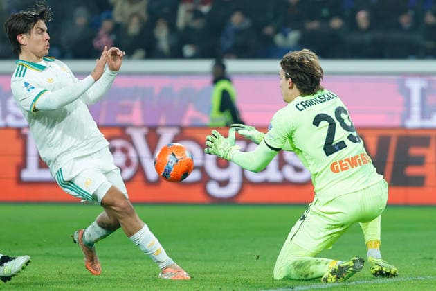 3rd January 2026; Gewiss Stadium, Bergamo, Italy, Serie A Football, Atalanta versus Roma; Paulo Dybala of AS Roma under pressure from Marco Carnesecchi of Atalanta BC  EmanuelexPennacchio