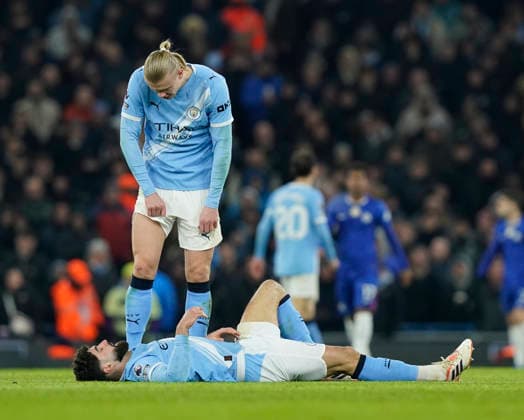 Manchester, England, 4th January 2026. Josko Gvardiol of Manchester City lies injured as Erling Haaland of Manchester City looks on during the Manchester City vs Chelsea Premier League match at the Etihad Stadium, Manchester. Picture credit should read: Andrew Yates Sportimage EDITORIAL USE ONLY. No use with unauthorised audio, video, data, fixture lists, club league logos or live services. Online in-match use limited to 120 images, no video emulation. No use in betting, games or single club league player publications. SPI_059_AY_Man_City_Chelsea SPI-4432-0058