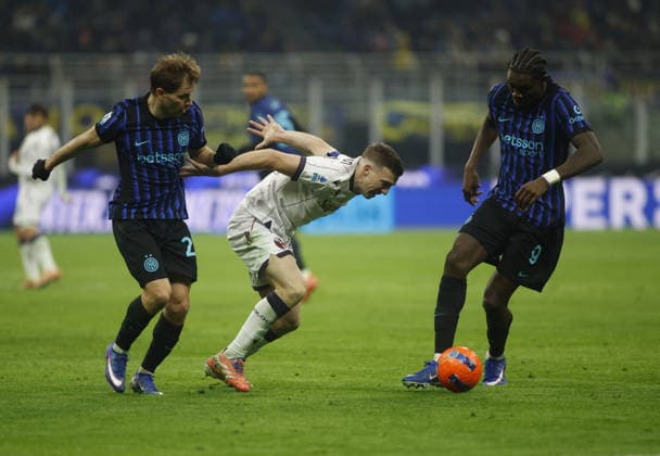 CALCIO - Serie A - Inter - FC Internazionale vs Bologna FC Nicolo Barella of FC Inter, Lewis Ferguson of Bologna FC and Marcus Thuram of FC Inter during the Italian Serie A, 2025 26 season, football match between FC Inter and Bologna FC on 04 January 2026, at Giuseppe Meazza Stadium, San Siro, Milan, Italy. Photo Nderim KACELI Milan Italy  Copyright: xIPAxSport ABACAx