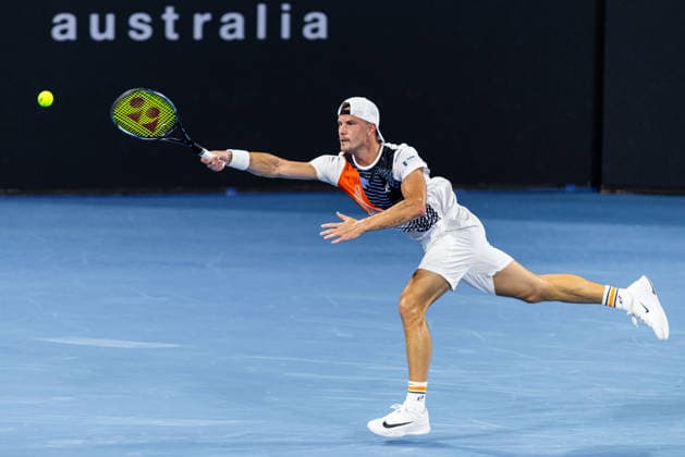 January 5, 2026, Brisbane, Qld, Australia: MARTON FUCSOVICS of Hungary reaches for the ball during his MenÃ¢â‚¬â ¢s Singles round one match against DANIIL MEDVEDEV of Russia at the Brisbane International. Brisbane Australia - ZUMAt173 20260105_zsp_t173_045 Copyright: xStephanexThomasx