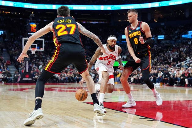 January 5, 2026, Toronto, On, CANADA: Toronto Raptors forward Brandon Ingram (3) drives to the net between Atlanta Hawks guard Vit Krejci (27) and teammate Kristaps Porzingis (8) during first half NBA, Basketball Herren, USA basketball action in Toronto, Monday, Jan. 5, 2026. Canada News - January 5, 2026 - ZUMAc35_ 20260105_zaf_c35_073 Copyright: xFrankxGunnx