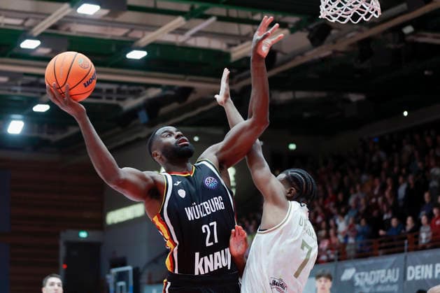 In the picture from left Eddy Edigin Wuerzburg Baskets, 27 against Gabe Dorse Patrioti Levice, 7 06 01 2026, Fitness First Wuerzburg Baskets vs Patrioti Levice, Basketball Champions League, Play Ins, Game 1, Germany, 97072, tectake Arena Wuerzburg, Copyright: HMBxMedia xJulienxBecker