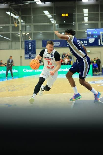 Game action with 19 MLP Academics Heidelberg and David Nejezchleb 9 Basketball Nymburk on the court Basketball Champions League MLP Academics Heidelberg - ERA Basketball Nymburk Game action with 19 MLP Academics Heidelberg and David Nejezchleb 9 Basketball Nymburk Copyright: xspeedshotx