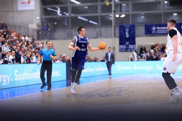 Game action with Ryan Mikesell 33 MLP Academics Heidelberg on the court Basketball Champions League MLP Academics Heidelberg - ERA Basketball Nymburk Ryan Mikesell 33 MLP Academics Heidelberg with ball in action Copyright: xspeedshotx