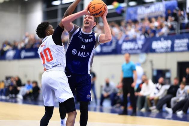 Scene with Ryan Mikesell 33 MLP Academics Heidelberg and Sir Jabari Rice 10 Basketball Nymburk in action Basketball Champions League MLP Academics Heidelberg - ERA Basketball Nymburk Ryan Mikesell 33 MLP Academics Heidelberg with ball against Sir Jabari Rice 10 Basketball Nymburk Copyright: xspeedshotx