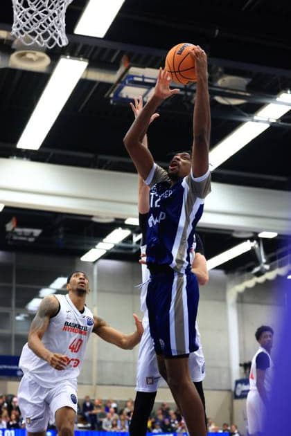 Game action with Jaquan Lawrence 40 Basketball Nymburg and Osun Osunniyi 12 MLP Academics Heidelberg at the basket Basketball Champions League MLP Academics Heidelberg - ERA Basketball Nymburk Jaquan Lawrence 40 Basketball Nymburg with a shot at the basket Copyright: xspeedshotx