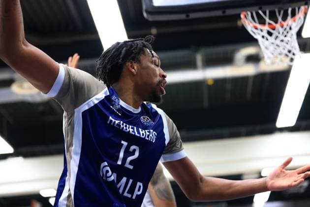 Game action with Osun Osunniyi 12 MLP Academics Heidelberg at the basket in the Basketball Champions League MLP Academics Heidelberg - ERA Basketball Nymburk Osun Osunniyi 12 MLP Academics Heidelberg in action Copyright: xspeedshotx